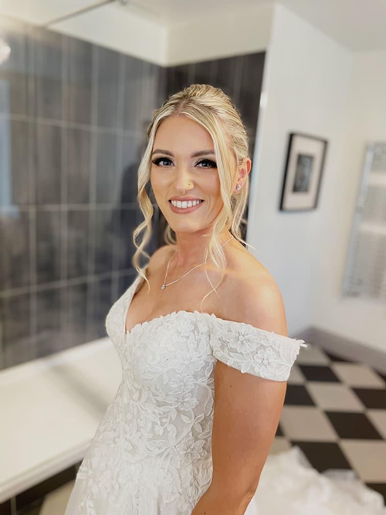 bride in wedding dress with makeup on