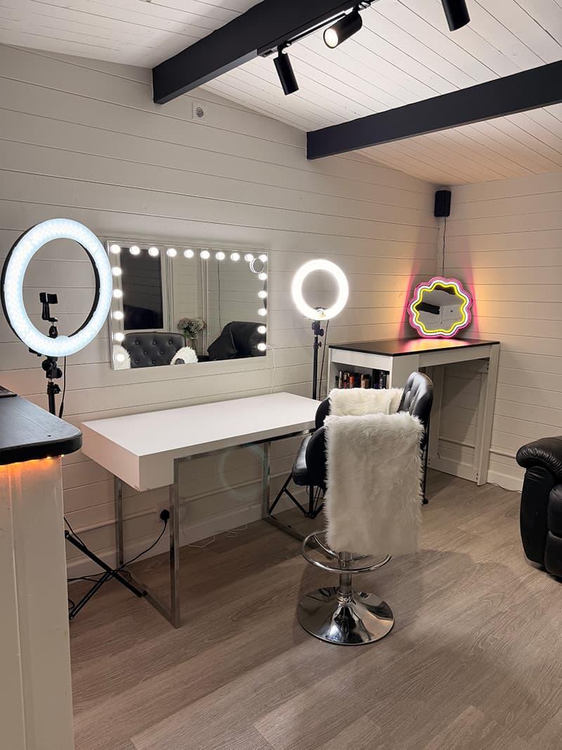 Makeup station at CB Studio with ring lights and illuminated mirror