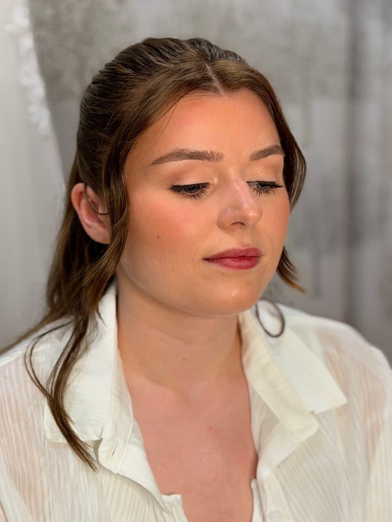 Bride having her makeup done for her wedding day
