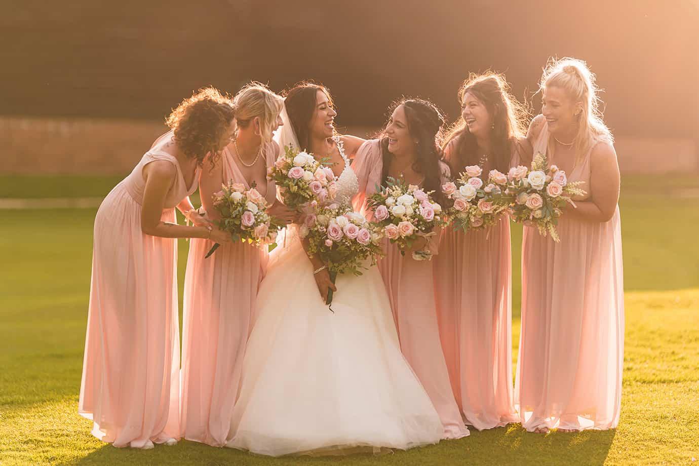 Bridesmaids laughing together on wedding morning